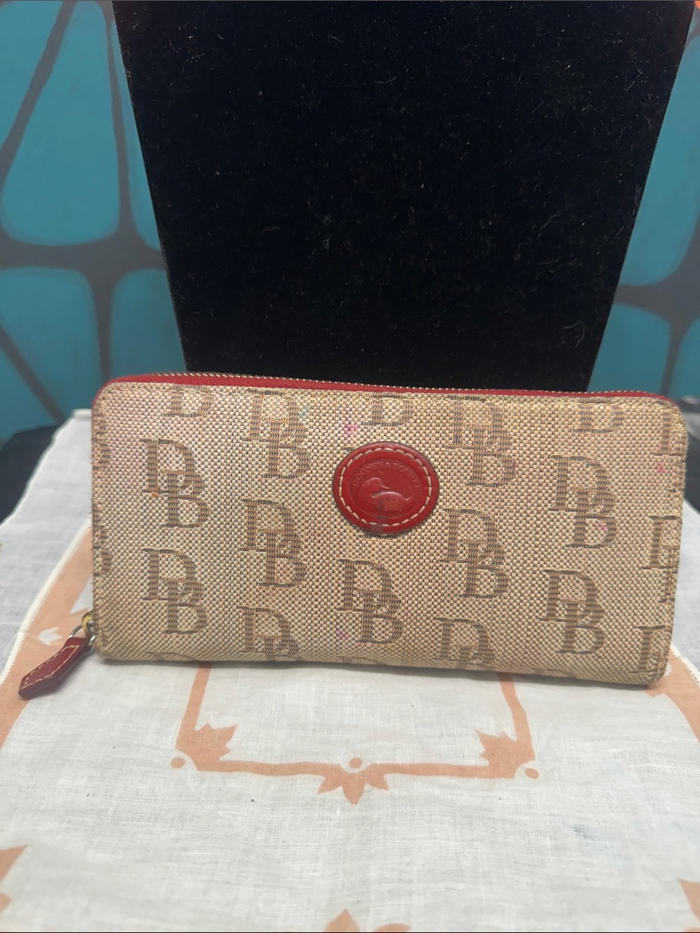 Dooney & Bourke Tan Signature Wallet with Red Trim